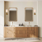 Modern brass wall sconce featuring a white fabric shade and warm brass finish