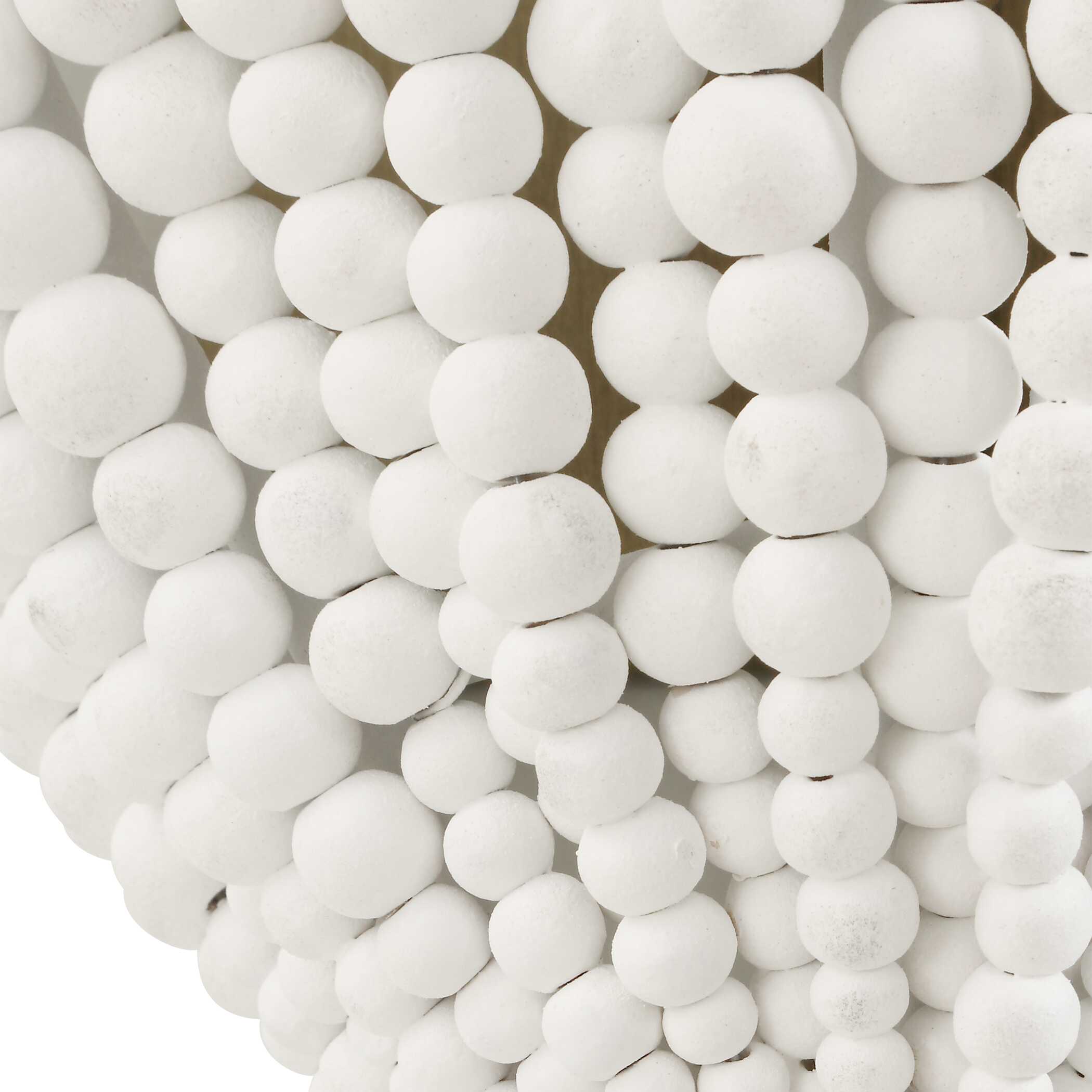 White beaded wall sconce with handcrafted wood beads