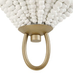 Coastal beaded wall sconce in bedroom