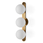 Droplet mid century wall sconce installed vertically in a hallway