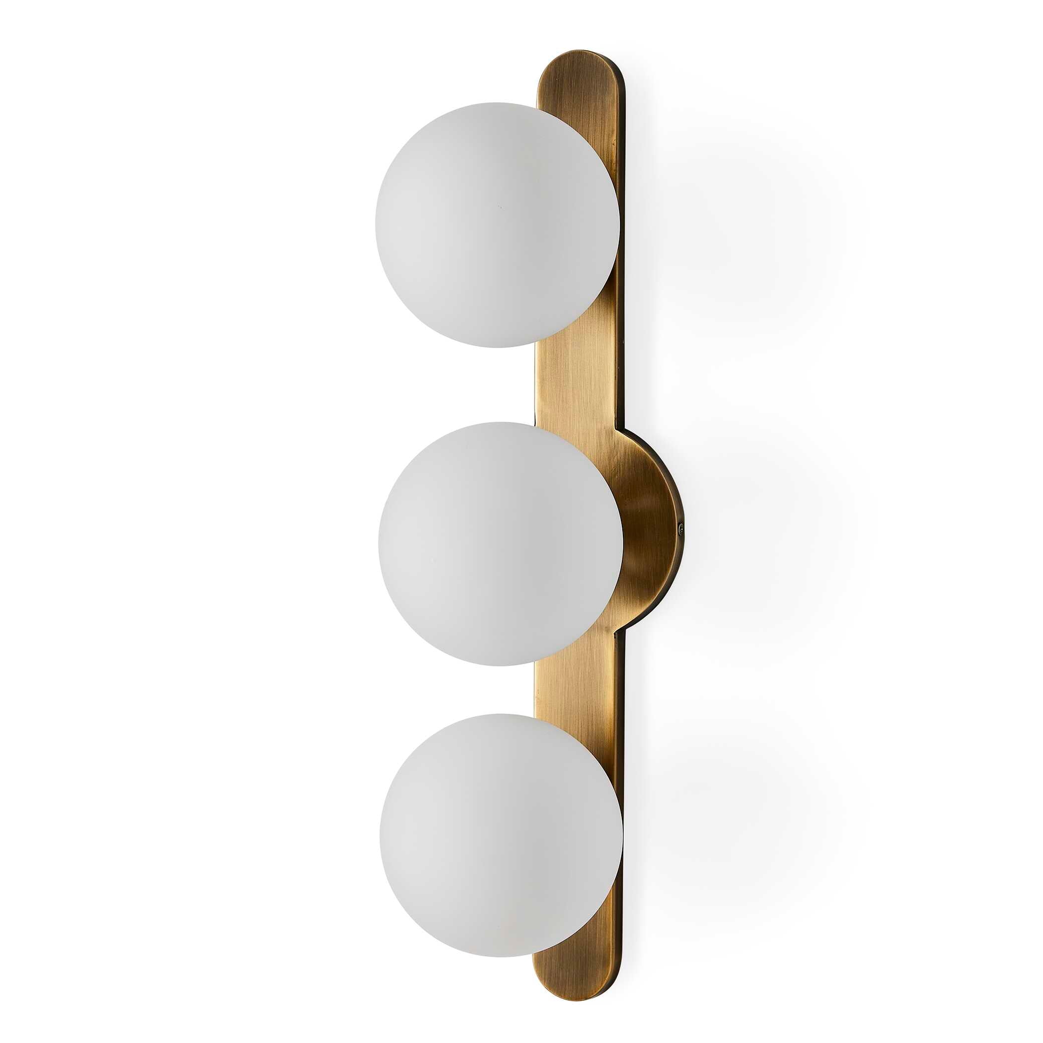 Droplet mid century wall sconce installed vertically in a hallway