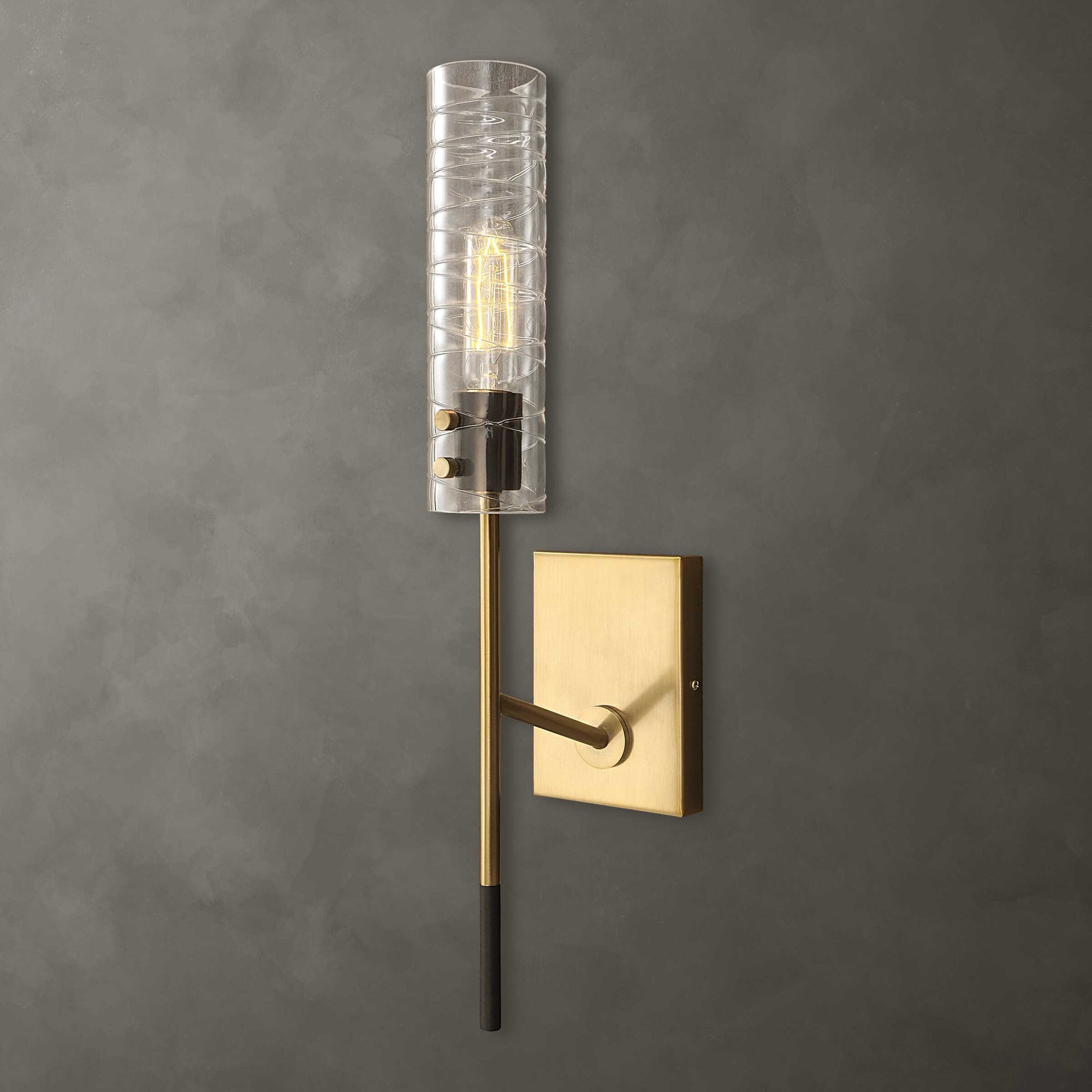 Telesto 1 Light Glass Wall Sconce with antique brass finish and clear glass shade by Ash + Co Interiors